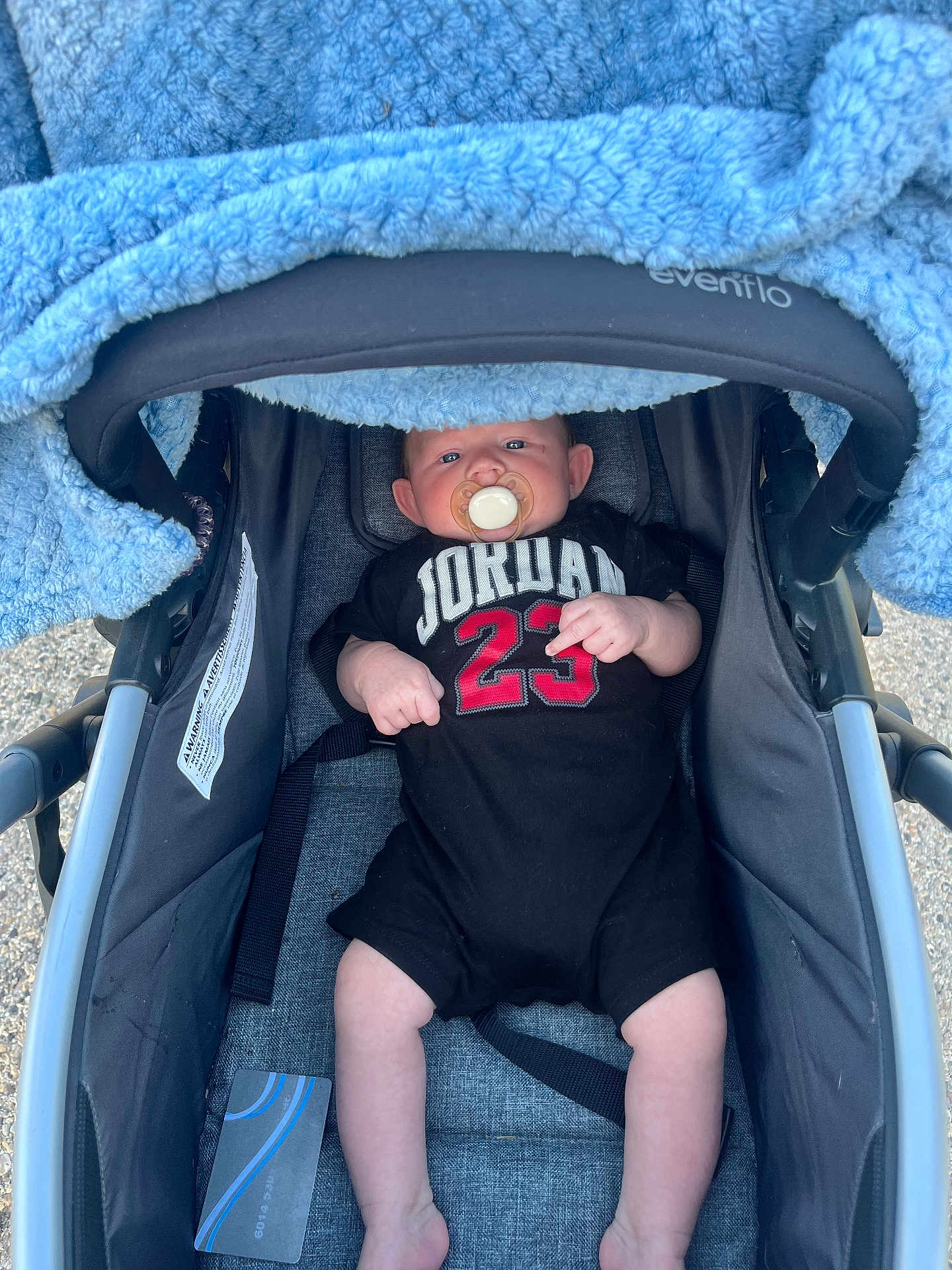 Lavar joined the competition — help win amazing prizes! baby, baby_boy, baby_face, baby_gear, baby_girl, baby_legs, black_onesie, blanket, child, clothing, comfort, cute, infant, infant_clothing, outdoor, pacifier, person, relaxing, stroller, young_child