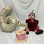 Elisa a rejoint le concours — aidez-le/la à gagner de superbes lots ! baby, child, birthday_cake, balloon, number_six, pink, red_dress, shoes, celebration, milestone, indoors, white_backdrop, sitting, cute, portrait, ribbons, decoration, party, infant, festive