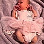 Aviya is registered to the contest to win money with this photo: newborn, baby, infant, pink_clothing, tutu, blanket, lying_down, soft_texture, cute, small_hands, small_feet, sleepwear, portrait, indoors, child, skin, head, face, resting, cozy