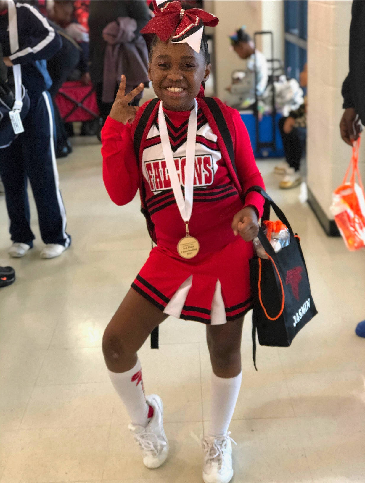 Jasmin is registered to the contest to win money with this photo: cheerleading, cheerleading_uniform, cosplay, costume, headwear, joy, majorette_dancer, person, team, tournament, uniform