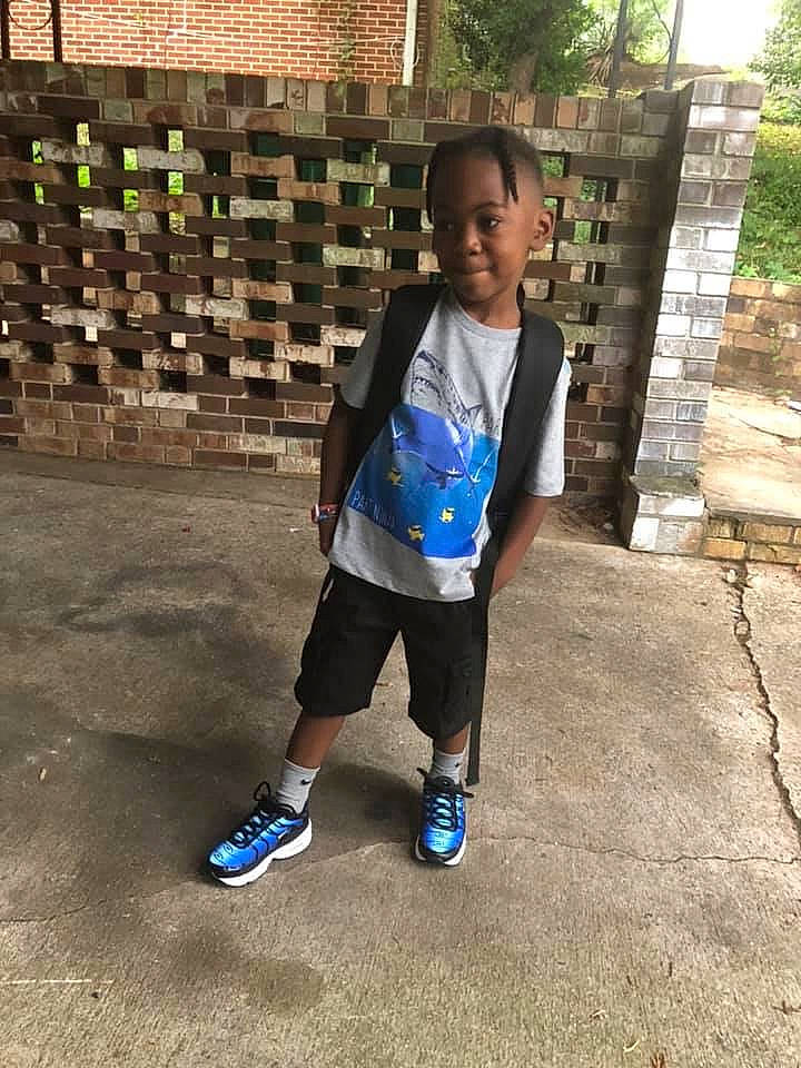 Jamari is registered to the contest to win money with this photo: child, footwear, person, play, shoe, standing, toddler