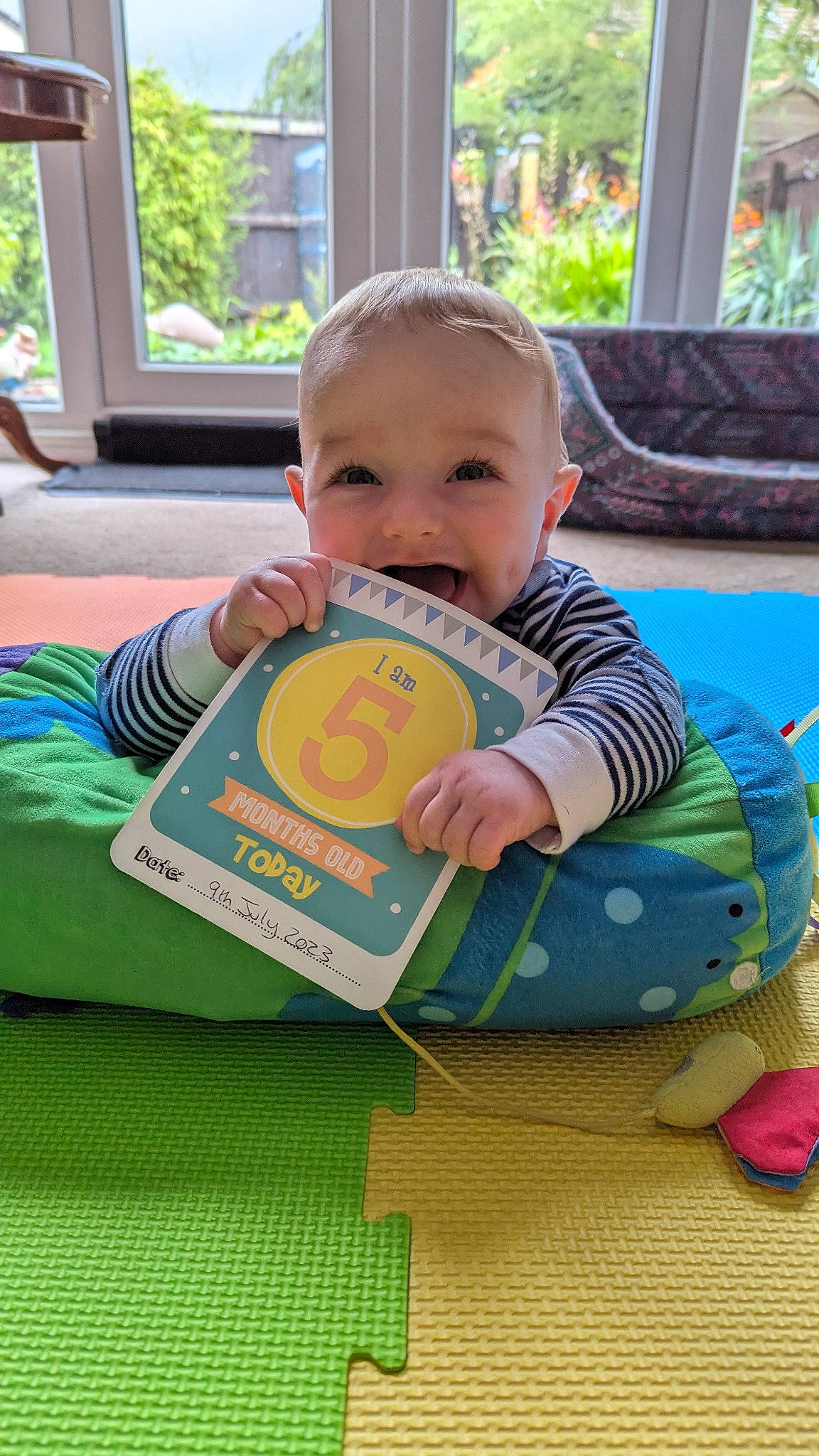Ethan joined the competition — help win amazing prizes! baby, baby_playing_with_toys, baby_products, baby_safety, baby_toddler_clothing, child, facial_expression, fun, grass, happy, leisure, person, play, product, recreation, room, sharing, sitting, smile, toddler