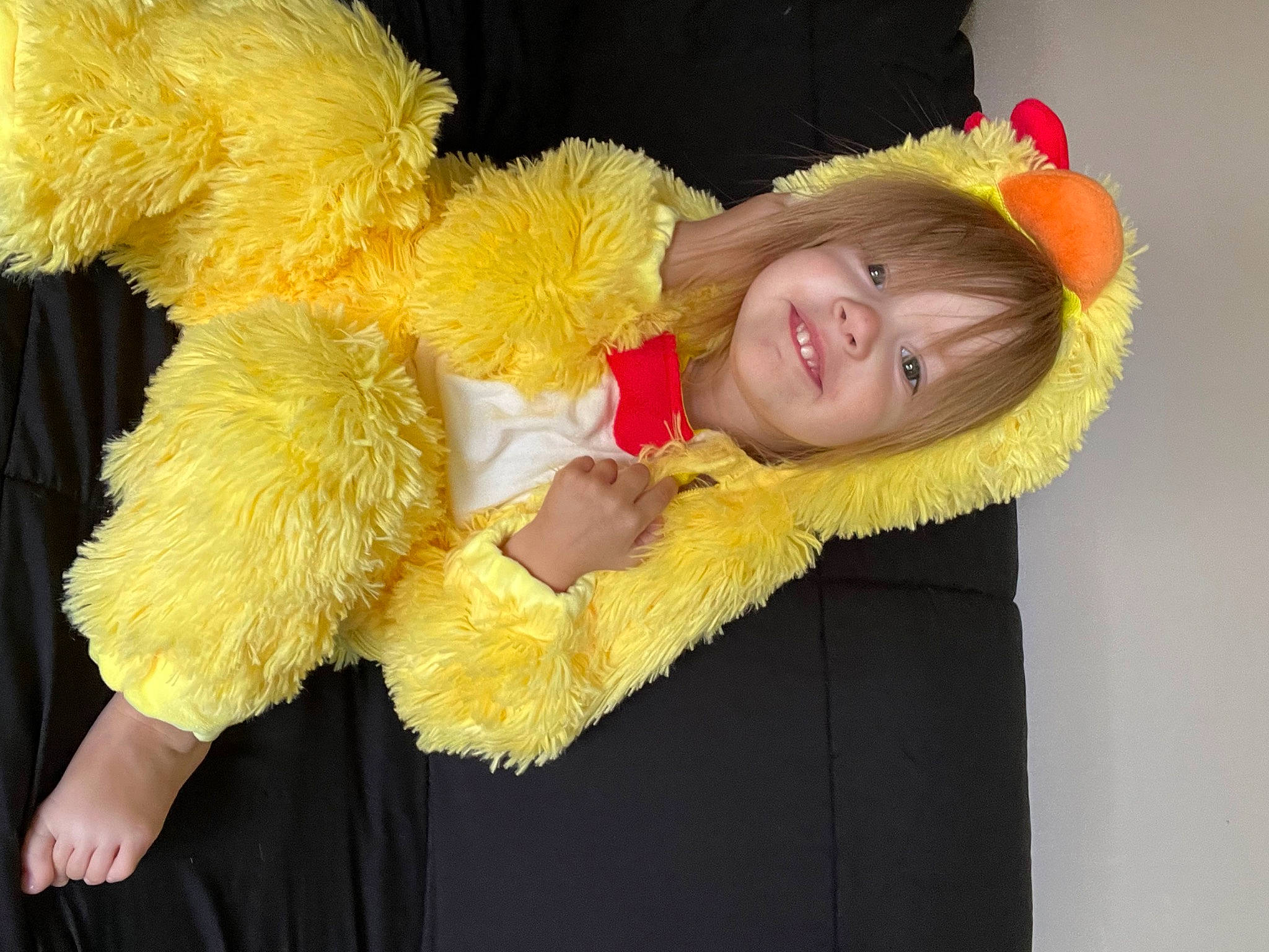 Sterling is registered to the contest to win money with this photo: baby, baby_toddler_clothing, child, costume, costume_accessory, costume_hat, event, feather_boa, fun, fur, fur_clothing, happy, joy, peach, person, plant, smile, stuffed_toy, teddy_bear, textile