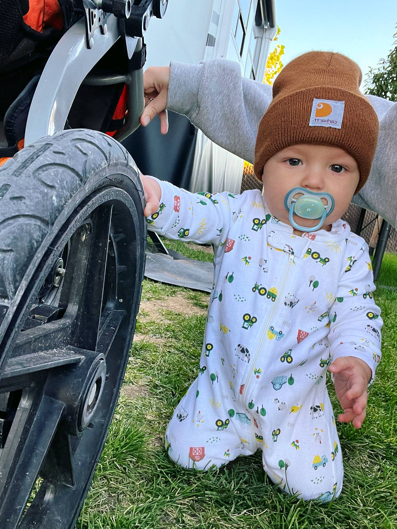 Gunner joined the competition — help win amazing prizes! alloy_wheel, automotive_design, automotive_tire, baby, baby_toddler_clothing, bicycle_accessory, bicycle_tire, bicycle_wheel, fender, grass, green, happy, hat, headwear, motor_vehicle, person, rim, synthetic_rubber, tire, tread