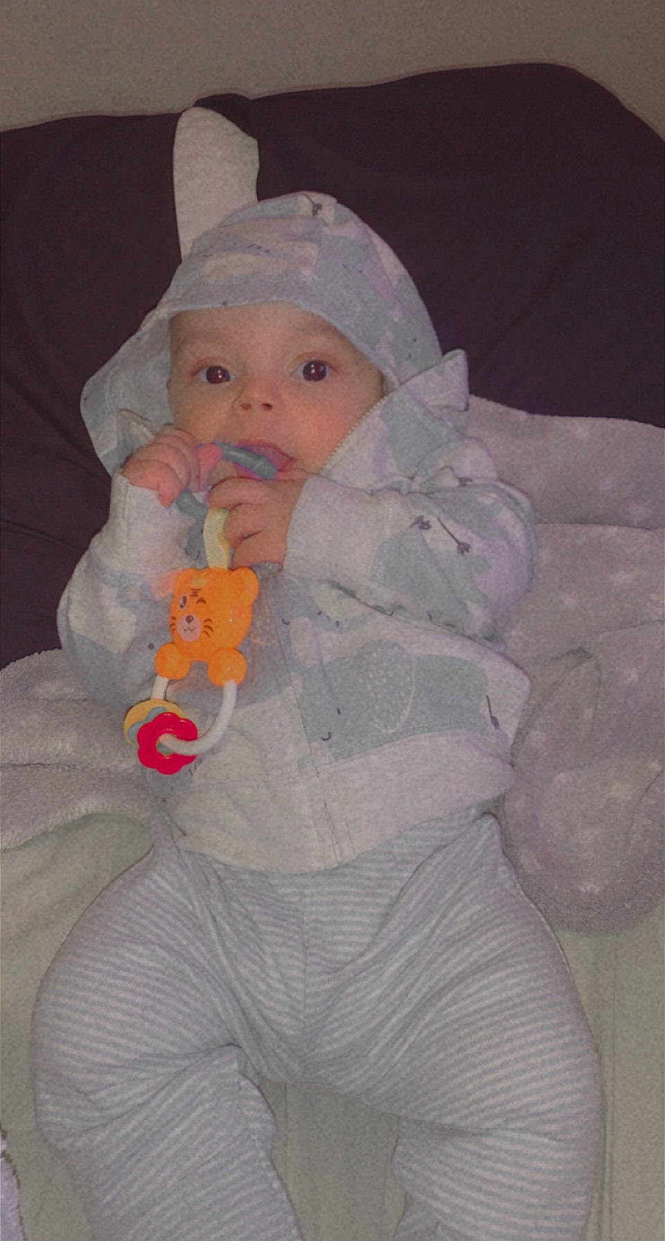 Dakai is registered to the contest to win money with this photo: baby, baby_products, baby_toddler_clothing, beanie, cap, cheek, child, comfort, eye, hat, headgear, headwear, human_body, iris, lap, lip, nail, nose, person, sitting