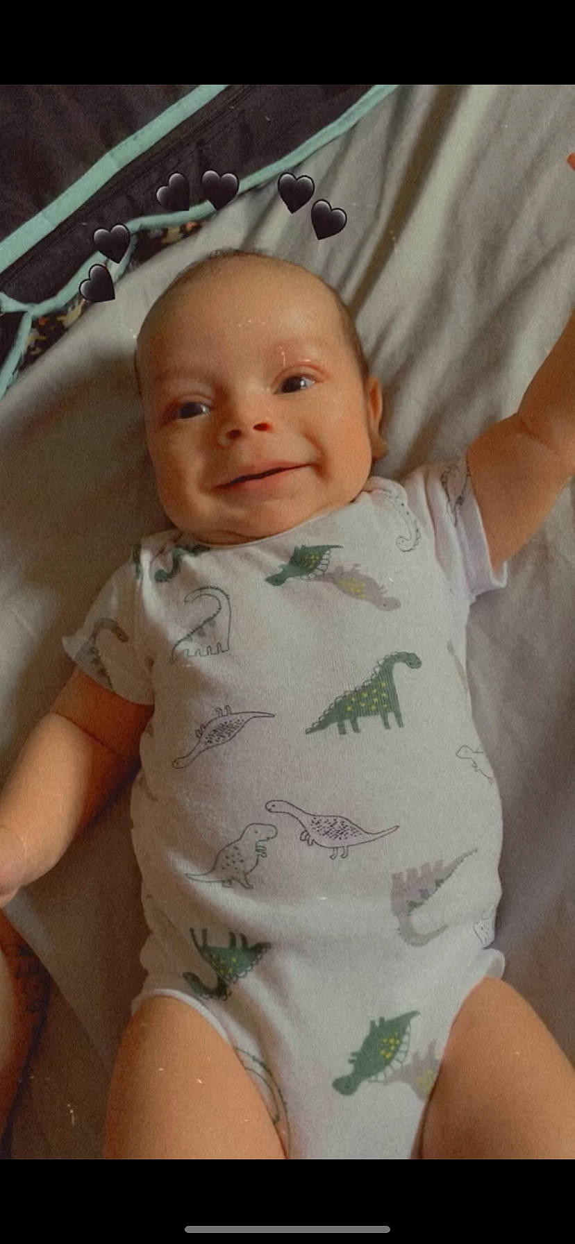 Dakai is registered to the contest to win money with this photo: baby, baby_toddler_clothing, cheek, chin, comfort, eye, eyebrow, face, happy, head, iris, lip, mouth, nose, person, pink, skin, sleeve, smile, stomach