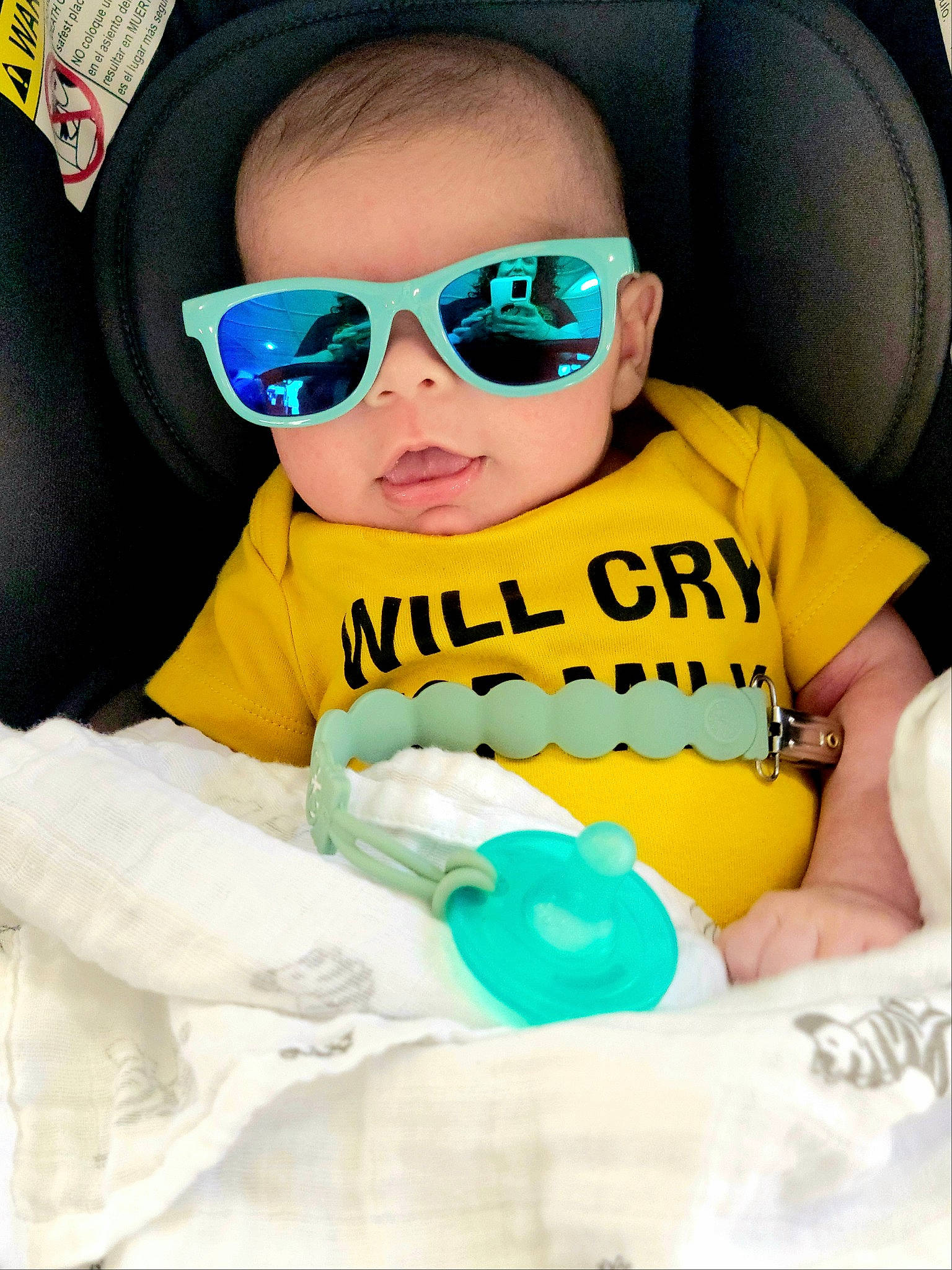 Hazel is registered to the contest to win money with this photo: baby, baby_toddler_clothing, car_seat, child, comfort, cool, eyewear, facial_expression, fun, glasses, goggles, hairstyle, happy, mouth, person, personal_protective_equipment, sunglasses, t_shirt, textile, toddler
