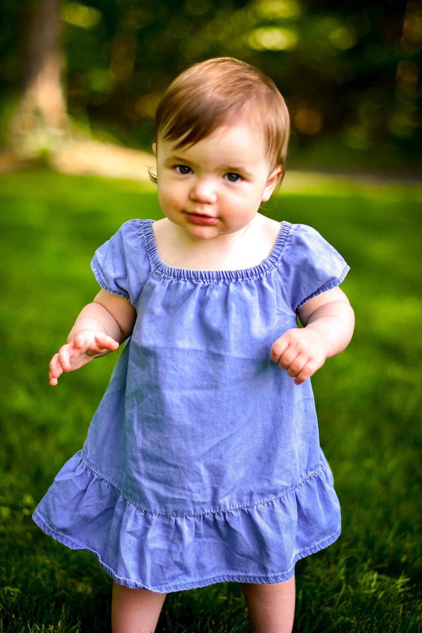 Aiyana is registered to the contest to win money with this photo: baby_toddler_clothing, child, day_dress, dress, electric_blue, fun, gesture, grass, green, happy, leaf, one_piece_garment, people_in_nature, person, plant, recreation, sleeve, smile, summer, t_shirt