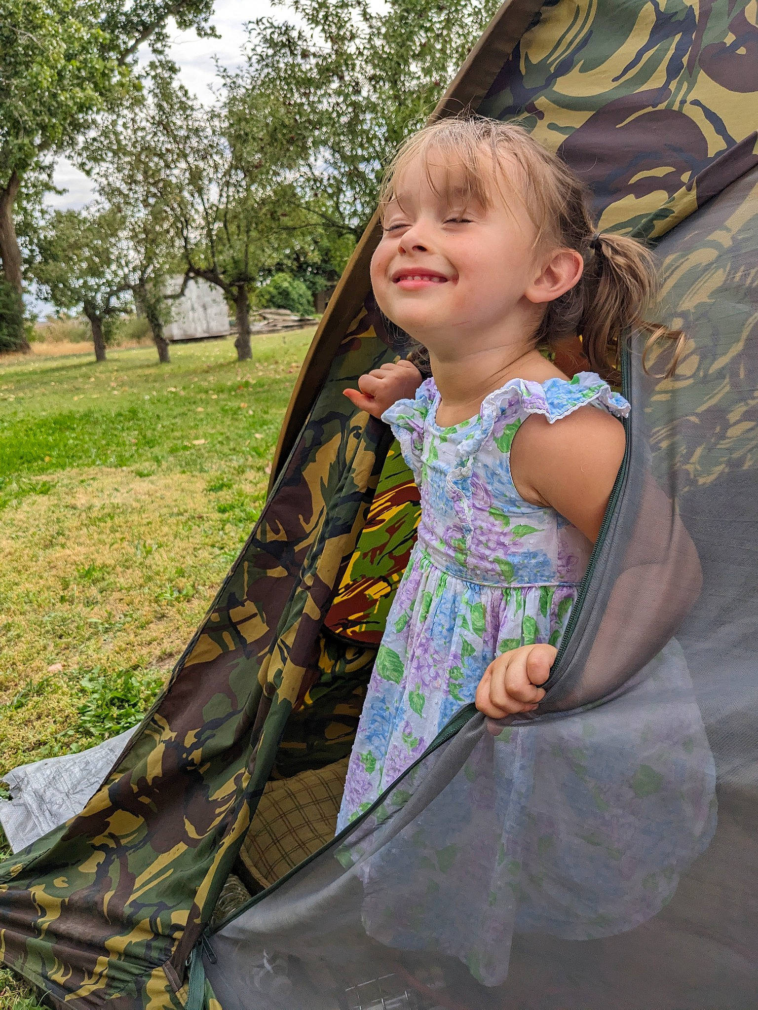 Ariel is registered to the contest to win money with this photo: baby, child, dress, event, fun, grass, happy, joy, leisure, pattern, people_in_nature, person, plant, play, recreation, sitting, smile, summer, t_shirt, tints_and_shades