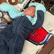 Colten joined the competition — help win amazing prizes! baby, sleeping, crib, blanket, stuffed_toy, rattle, onesie, cozy, nursery, child, infant, soft, toy, bed, sleepwear, cushion, pacifier, fabric, carpet, wood