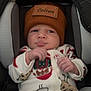 baby, infant, hat, pajamas, car_seat, face, child, clothing, cute, indoors, sitting, expression, pout, warm, cozy, newborn, person, portrait, winter, bundle