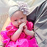 Ava joined the competition — help win amazing prizes! baby, child, infant, pink_dress, headband, flower, hands, cute, portrait, person, adult_arm, watch, fabric, soft_light, closeup, indoors, comfort, skin, face, expression
