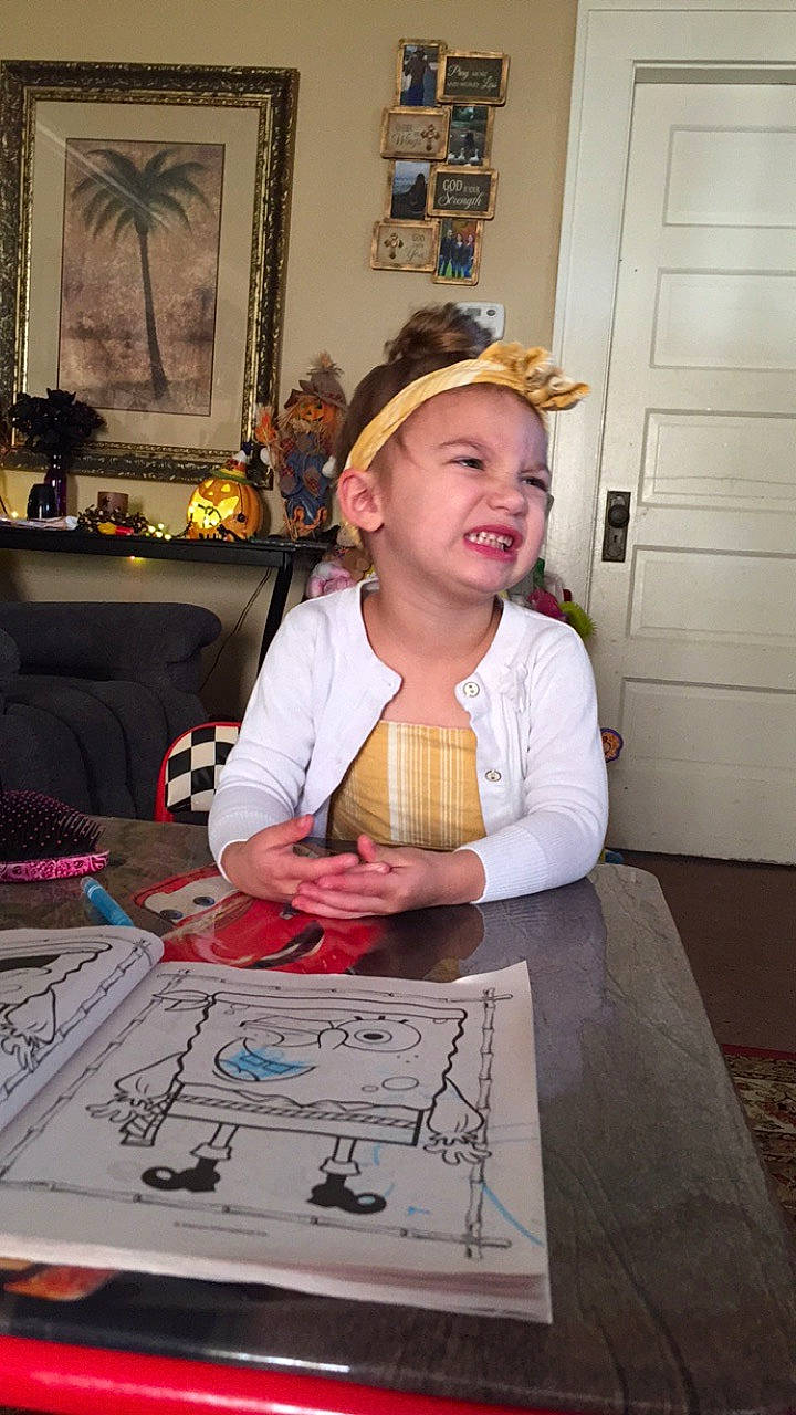 Annalynn is registered to the contest to win money with this photo: art, artist, automotive_design, cap, chair, child, door, drawing, engineering, event, fashion_design, fun, furniture, headwear, person, picture_frame, plate, room, t_shirt, table