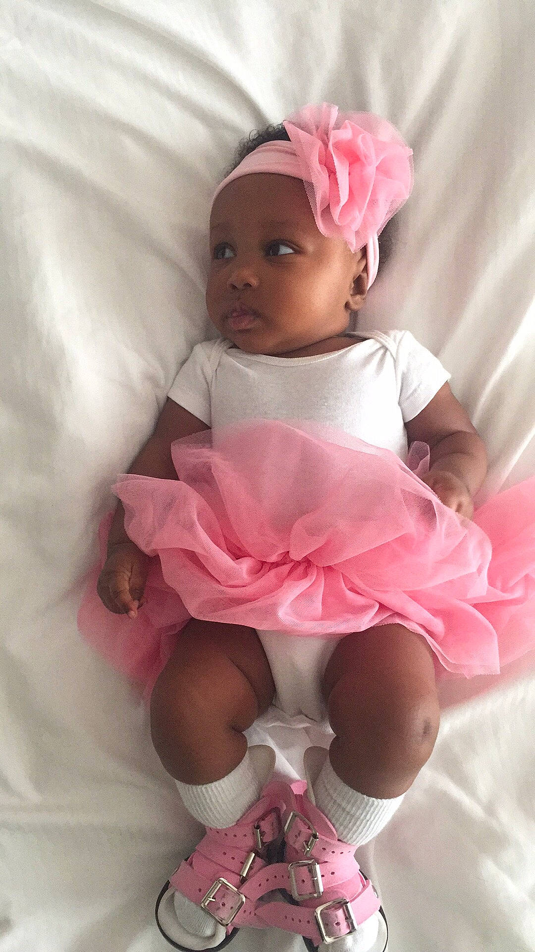 Zoee is registered to the contest to win money with this photo: baby_products, child, doll, girl, hair_accessory, headband, headgear, infant, magenta, pink, product, skin, textile, toddler