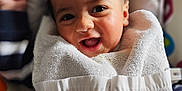 Soël participe au concours pour gagner de l'argent avec cette photo : baby, smiling, towel, infant, face, child, happy, cute, indoors, seat, colorful, pattern, clothing, portrait, young, skin, expression, cozy, comfort, fun