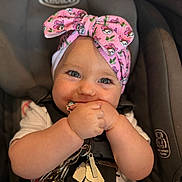 Harper-Raine joined the competition — help win amazing prizes! baby, infant, car_seat, headband, pink, keys, chewing, cute, child, closeup, face, smile, happy, straps, seatbelt, young_child, indoor, person, adorable, portrait