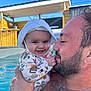 Malia a rejoint le concours — aidez-le/la à gagner de superbes lots ! baby, beard, child, clothing, cute, face, family, happy, hat, holding, man, necklace, outdoor, parent, pool, skin, smile, summer, sunlight, water