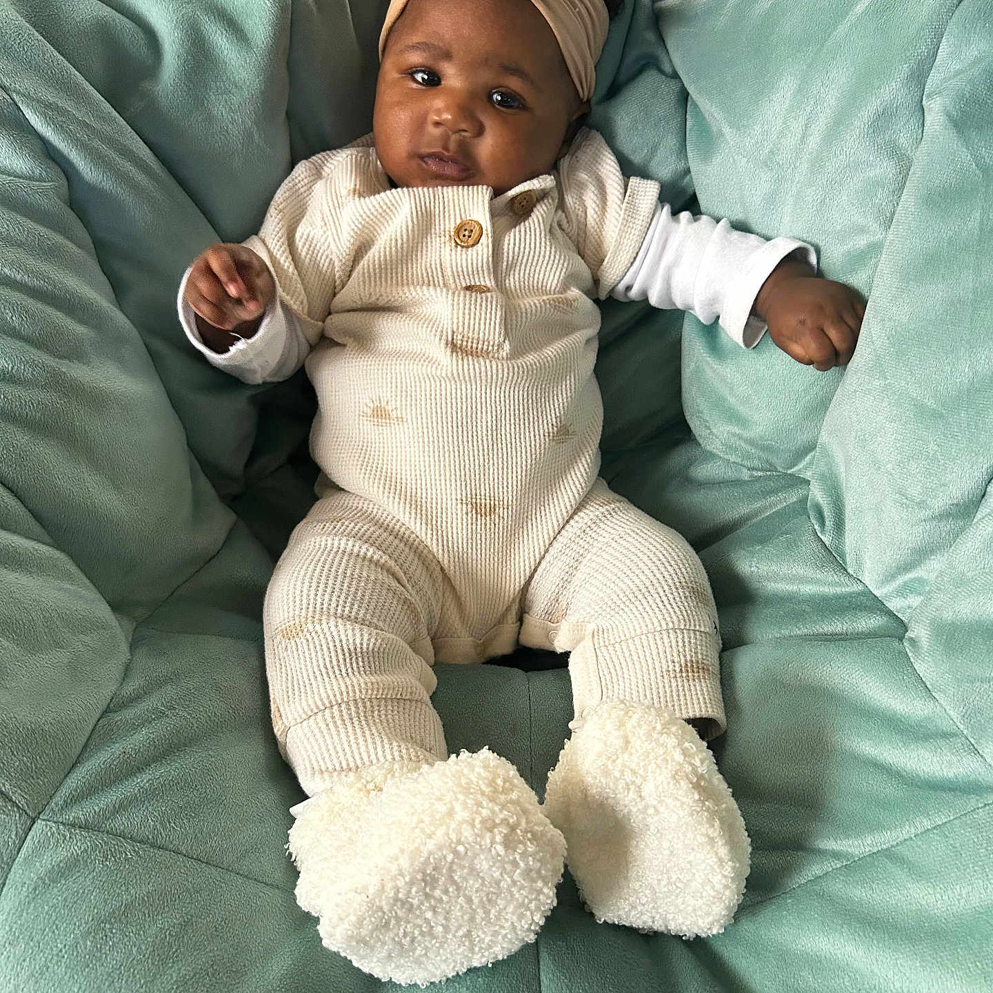 Emony is registered to the contest to win money with this photo: baby, bed, blanket, bonnet, clothing, couch, crib, cushion, face, furniture, hat, head, homedecor, infantbed, newborn, pants, person, photography, portrait, sitting