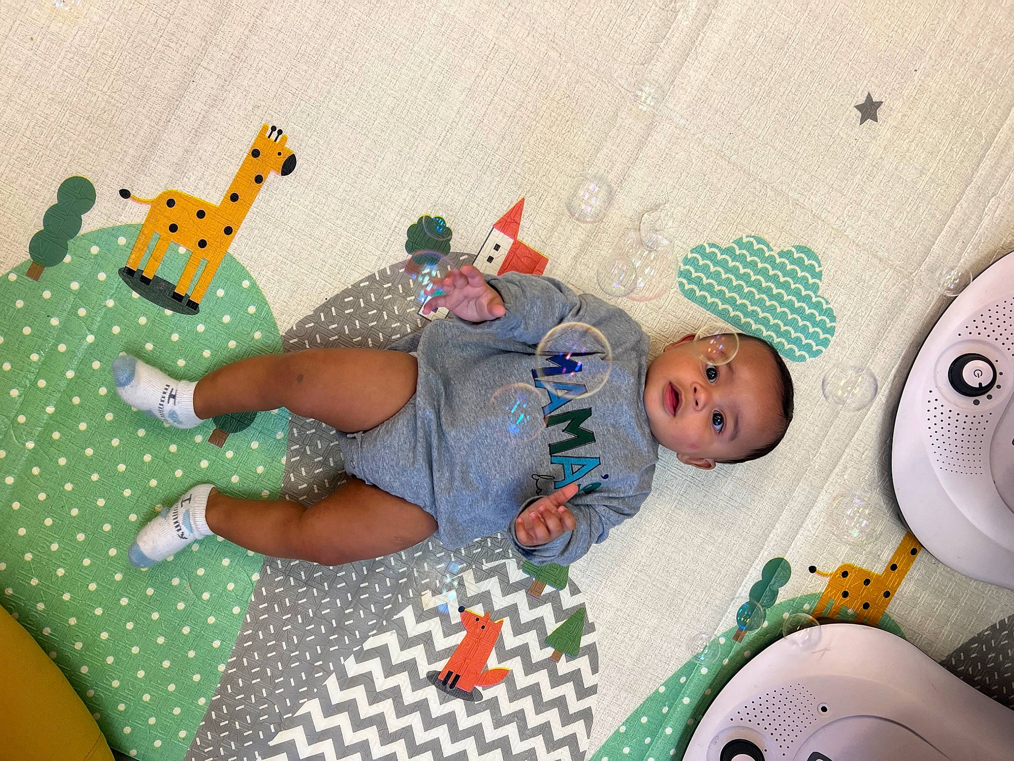 Kamden is registered to the contest to win money with this photo: baby, baby_products, baby_sleeping, baby_toddler_clothing, baby_toys, child, circle, comfort, fashion_accessory, linens, pattern, person, play, product, room, sandal, sock, stuffed_toy, t_shirt, textile