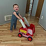 boy, carriage, child, clothing, face, hardwood, head, indoors, interiordesign, machine, male, pants, person, photography, plywood, portrait, transportation, vehicle, wheel, wood