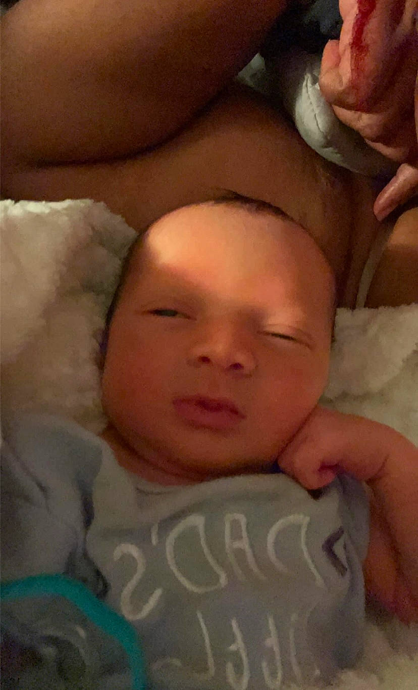 Bryston is registered to the contest to win money with this photo: baby, baby_sleeping, bedtime, cheek, child, chin, comfort, event, eyebrow, face, happy, head, linens, mammal, mouth, nap, nose, person, skin, thumb