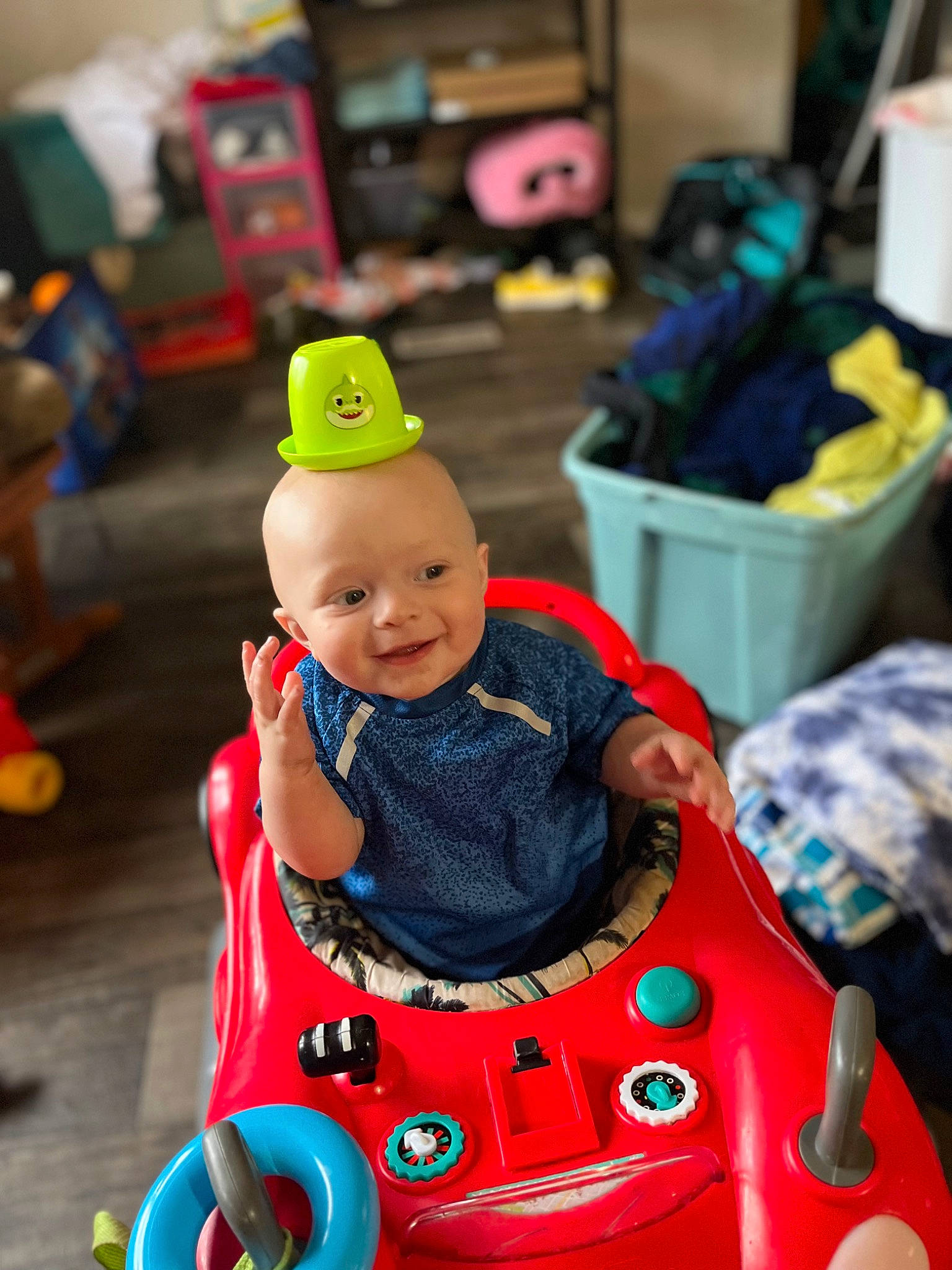 Collin is registered to the contest to win money with this photo: baby, baby_products, baby_toddler_clothing, baby_toys, child, event, fun, happy, holiday, joy, leisure, motor_vehicle, person, play, recreation, riding_toy, room, sitting, toddler, toy