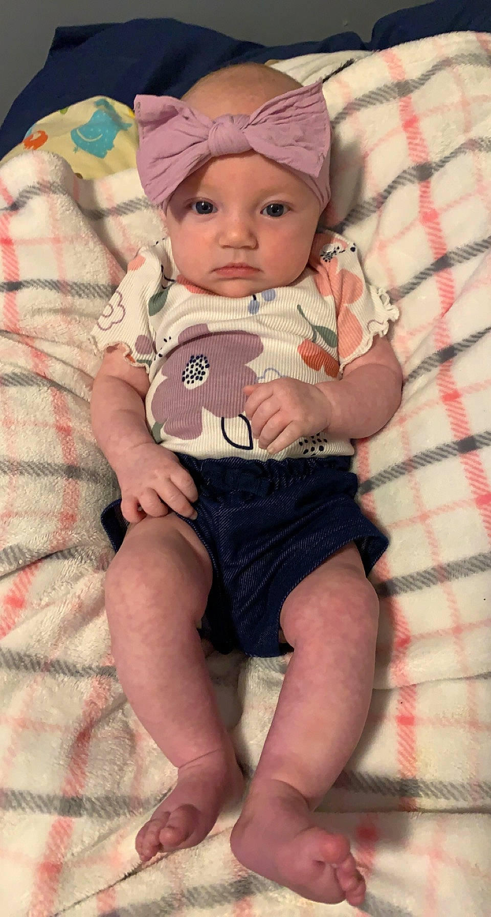 Gracelyn is registered to the contest to win money with this photo: baby, baby_toddler_clothing, cap, cheek, child, comfort, eyelash, headwear, human_body, leg, lip, pattern, person, pink, sitting, skin, sleeve, sock, sun_hat, textile