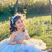 Mishaya joined the competition — help win amazing prizes! child, girl, smiling, dress, flower_headband, outdoor, grass, sunlight, fairy_tale, happy, portrait, cute, young_child, nature, sitting, playful, spring, fashion, costume, childhood