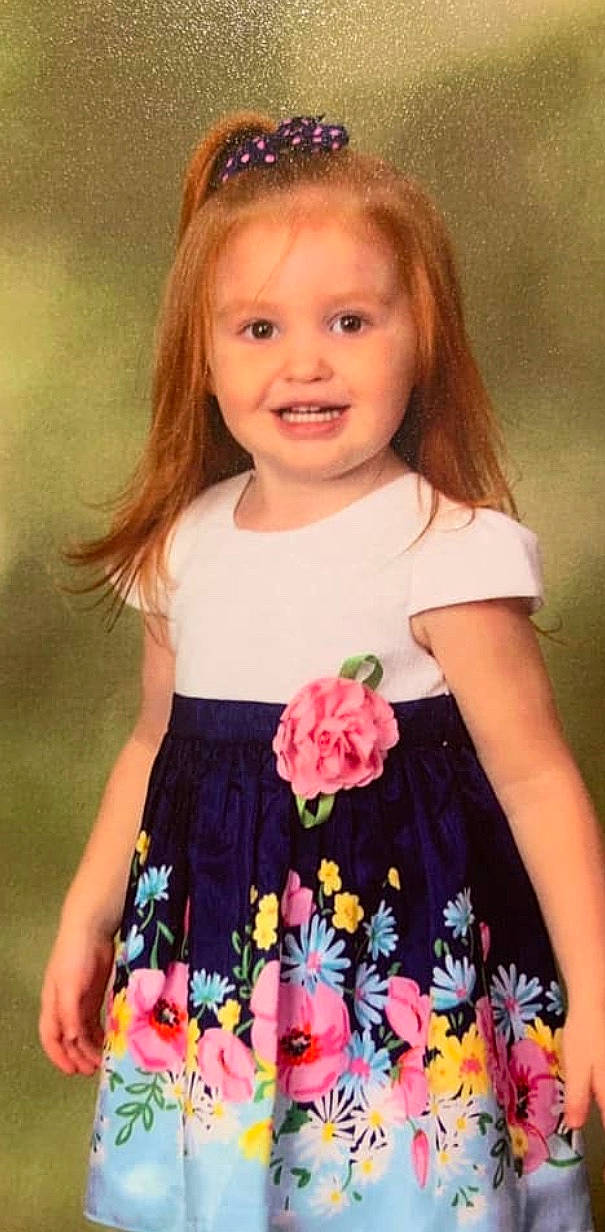 Cheyenne is registered to the contest to win money with this photo: brown_hair, child, child_model, clothing, dress, joy, pattern, person, pink, sleeve, toddler