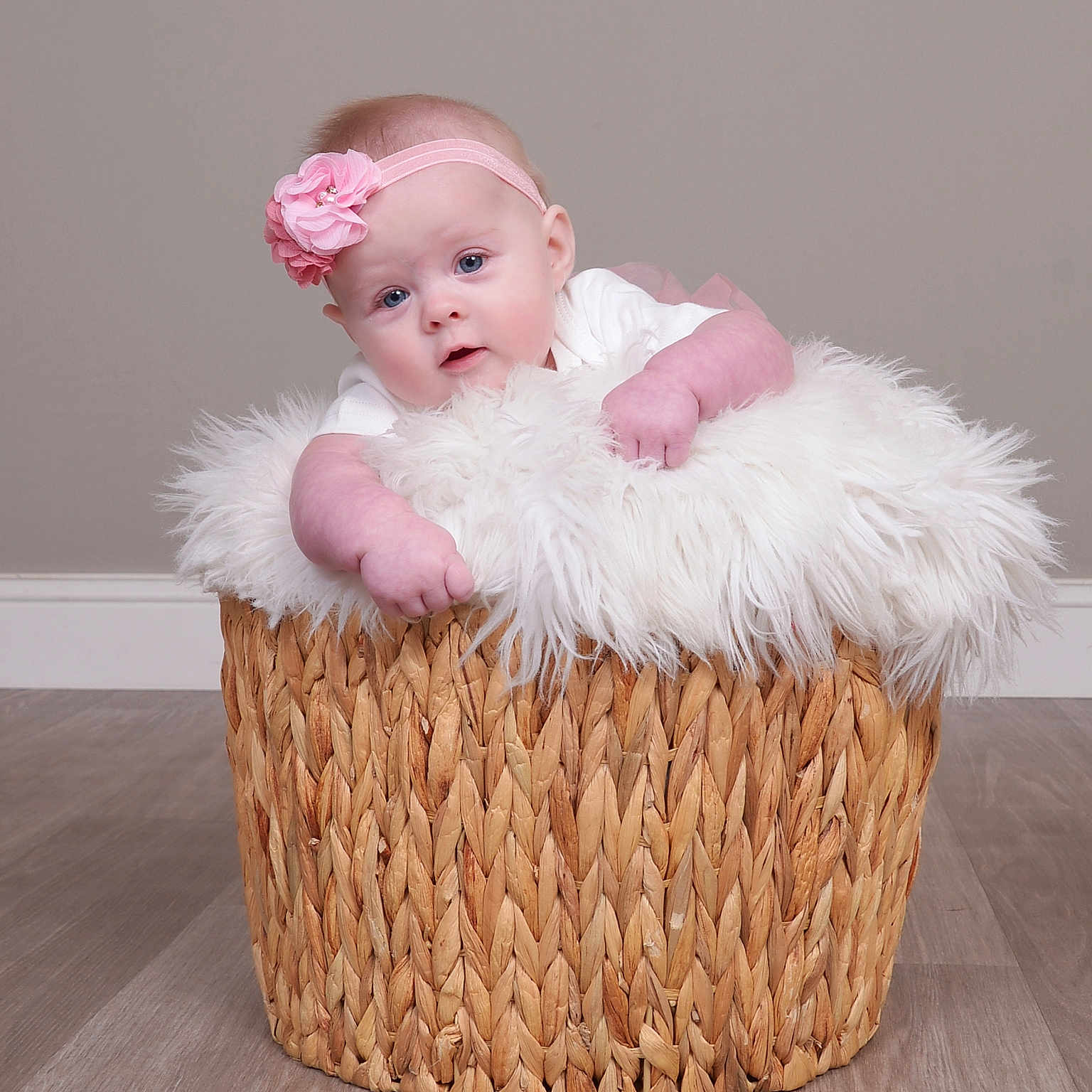 Lainey Mae is registered to the contest to win money with this photo: baby, basket, bed, bonnet, cake, clothing, cream, crib, face, furniture, hardwood, hat, head, infantbed, newborn, person, photography, portrait, wood, woven