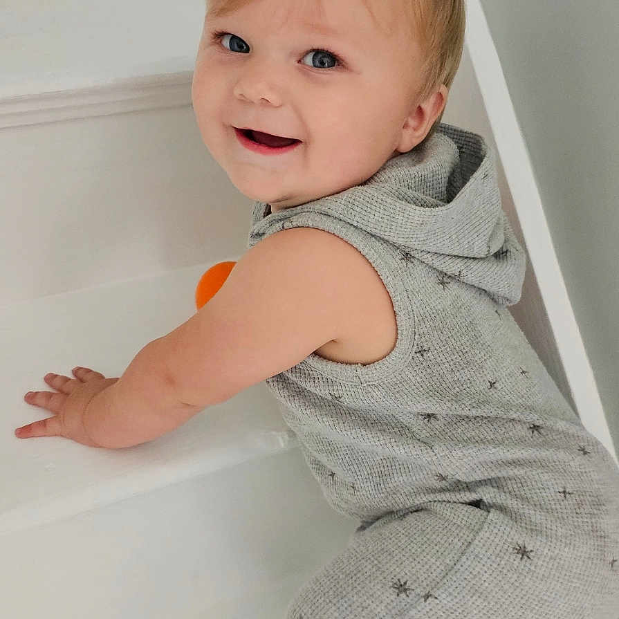 Mayson is registered to the contest to win money with this photo: baby, bathing, bathtub, bodypart, crawling, face, finger, furniture, hand, happy, head, indoors, person, photography, playarea, portrait, sitting, smile, tub, wrist