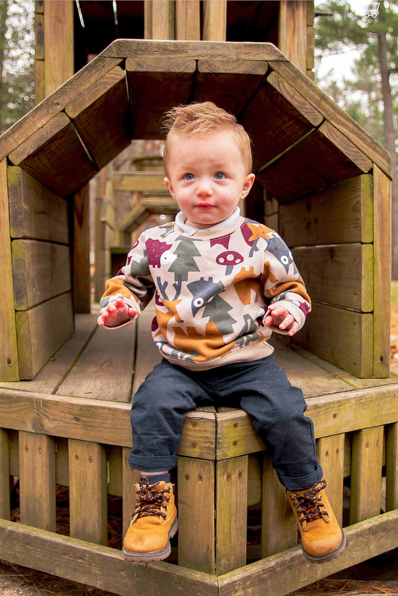 Azaiah is registered to the contest to win money with this photo: baby_toddler_clothing, boot, child, city, fun, grass, leisure, outdoor_furniture, outdoor_play_equipment, outerwear, person, play, recreation, shoe, sitting, sneakers, standing, toddler, tree, vacation