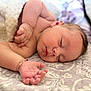 baby, bedspread, blanket, bracelet, closed_eyes, cozy, cute, face, hand, indoors, infant, lying_down, peaceful, portrait, rest, skin, sleeping, soft, toddler, young_child