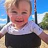 Paisleigh joined the competition — help win amazing prizes! blue_sky, casual, child, clothing, daylight, drool, face, hair, happy, metal_chain, nature, outdoor, park, playground, seat, smiling, sunlight, swing, toddler, tree
