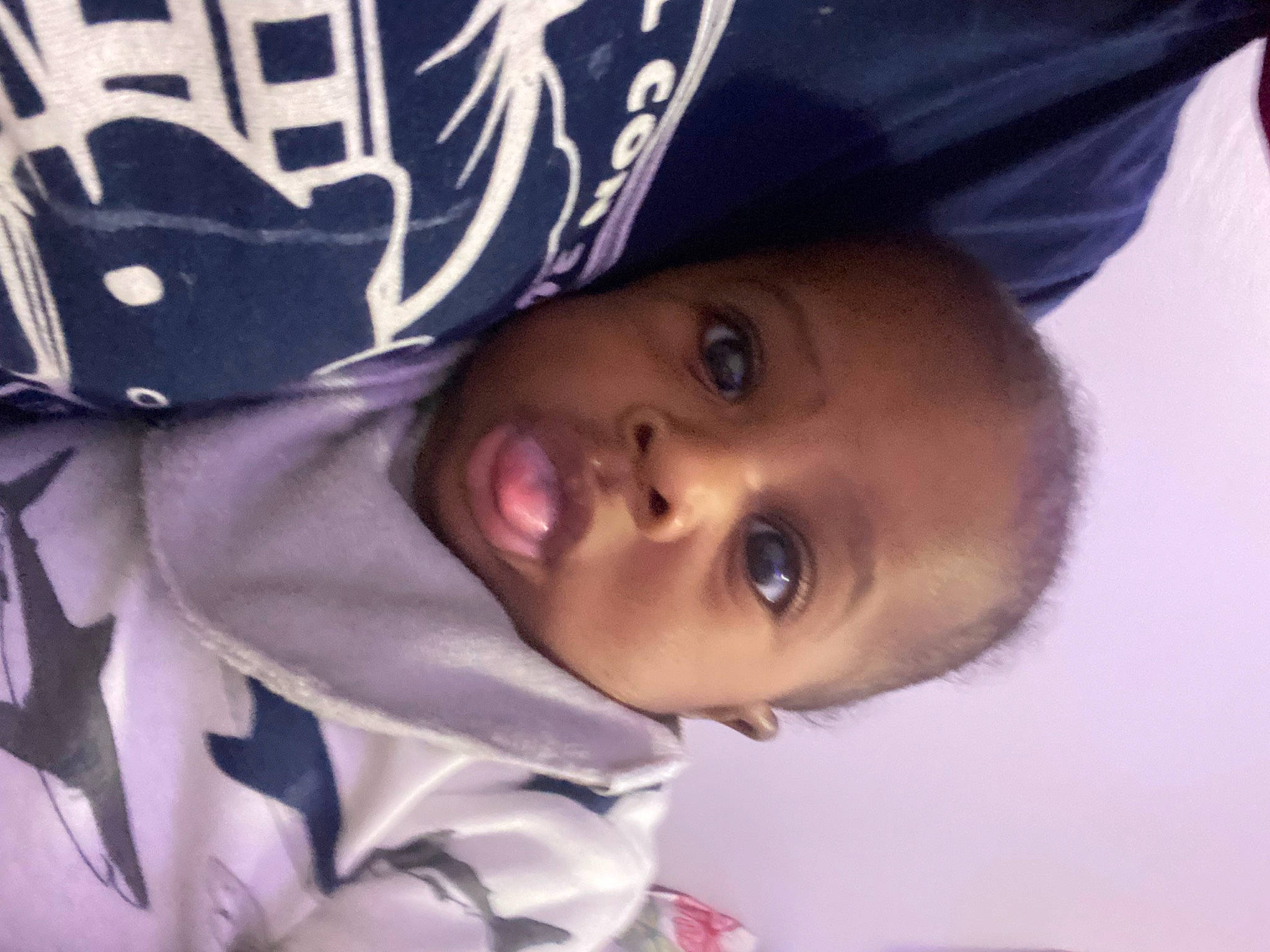 Hezekiah is registered to the contest to win money with this photo: baby, baby_toddler_clothing, cap, cheek, child, comfort, eye, eyelash, fashion_accessory, happy, hat, linens, lip, person, plant, portrait_photography, selfie, sleeve, toddler, tree