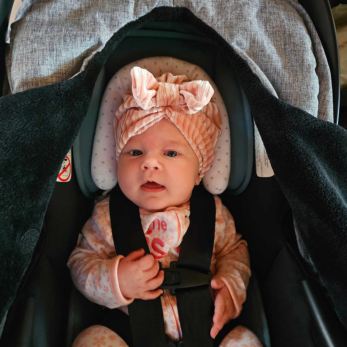 Athena joined the competition — help win amazing prizes! baby, bonnet, cap, car, car_interior, carseat, clothing, cushion, face, happy, hat, head, person, photography, portrait, sleeping, smile, stroller, transportation, vehicle