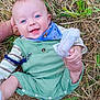 baby, infant, smiling, blue_eyes, green_clothing, bib, sock, hand, straw, grass, outdoor, cute, happy, person, portrait, lying_down, child, head_support, nature, playful