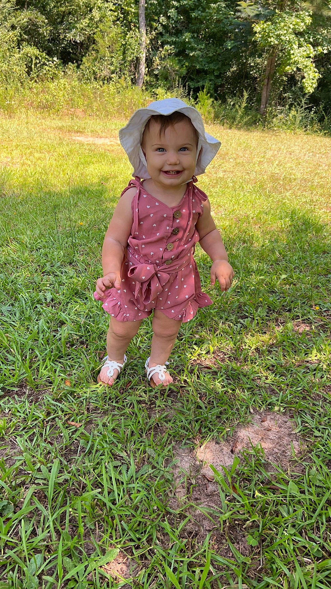 Emberlynn joined the competition — help win amazing prizes! baby, baby_toddler_clothing, botany, eye, grass, grassland, groundcover, happy, hat, joy, leaf, meadow, people_in_nature, person, plant, smile, summer, sun_hat, sunlight, toddler