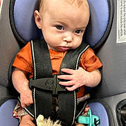 Lynnix joined the competition — help win amazing prizes! baby, car_seat, child, infant, harness, orange_shirt, plush_toy, pacifier, seatbelt, safety, person, cute, portrait, indoors, young_child, baby_hand, baby_face, car, seat, closeup