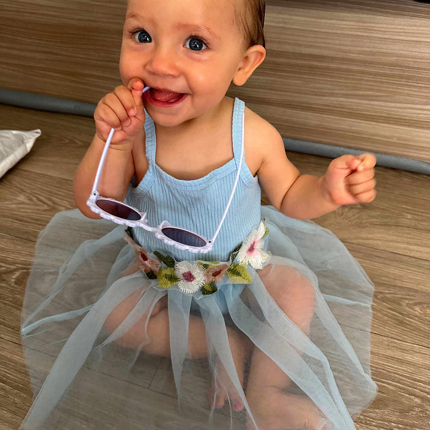 Amelia participe au concours pour gagner de l'argent avec cette photo : baby, bodypart, clothing, cream, cutlery, dessert, dress, face, finger, food, hand, hardwood, head, icecream, person, photography, portrait, sitting, spoon, wood