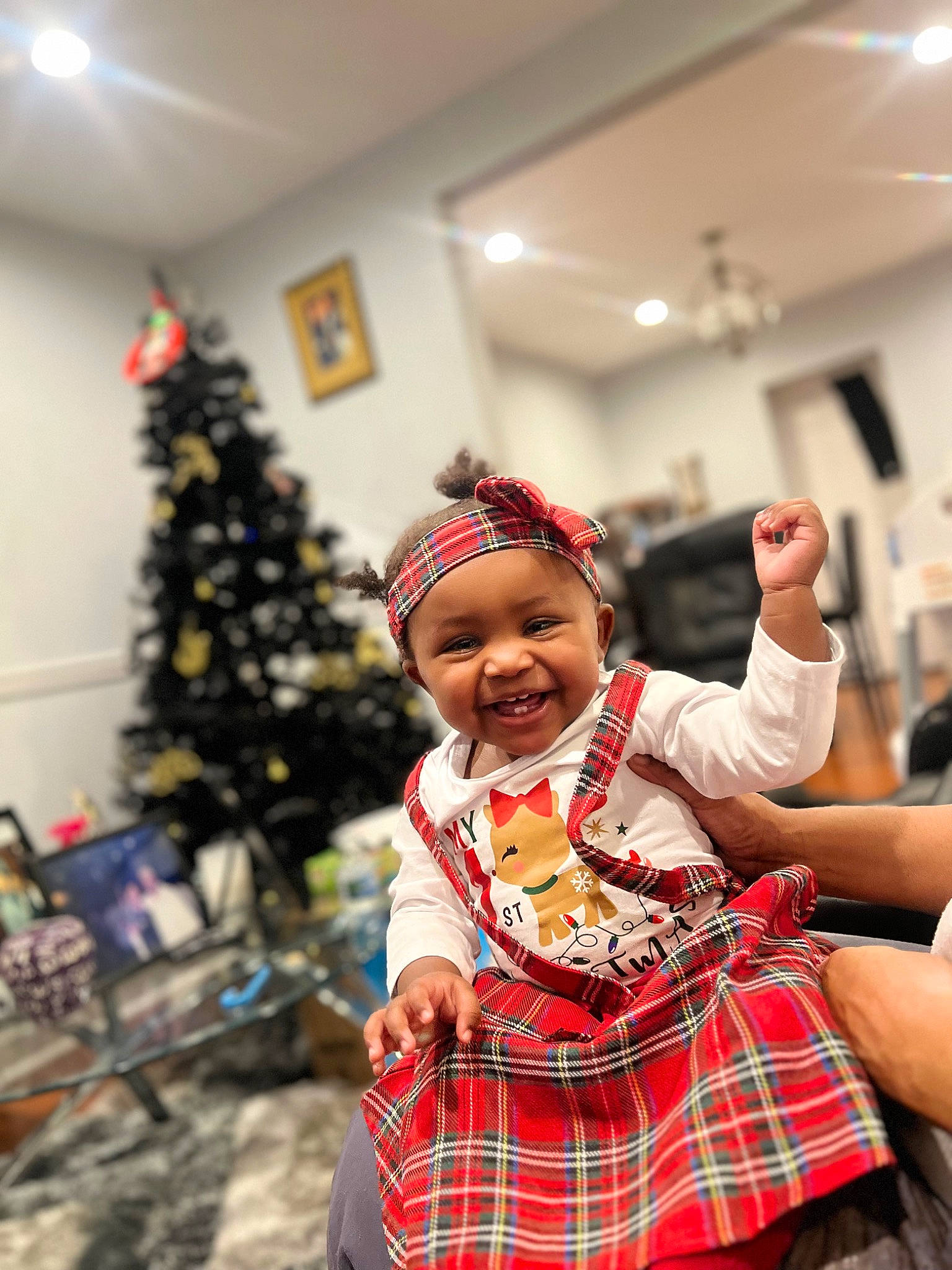 Brooke joined the competition — help win amazing prizes! child, christmas, christmas_decoration, christmas_eve, christmas_tree, conifer, event, fashion_design, fun, happy, headwear, holiday, joy, leisure, pattern, person, plaid, sitting, smile, tartan