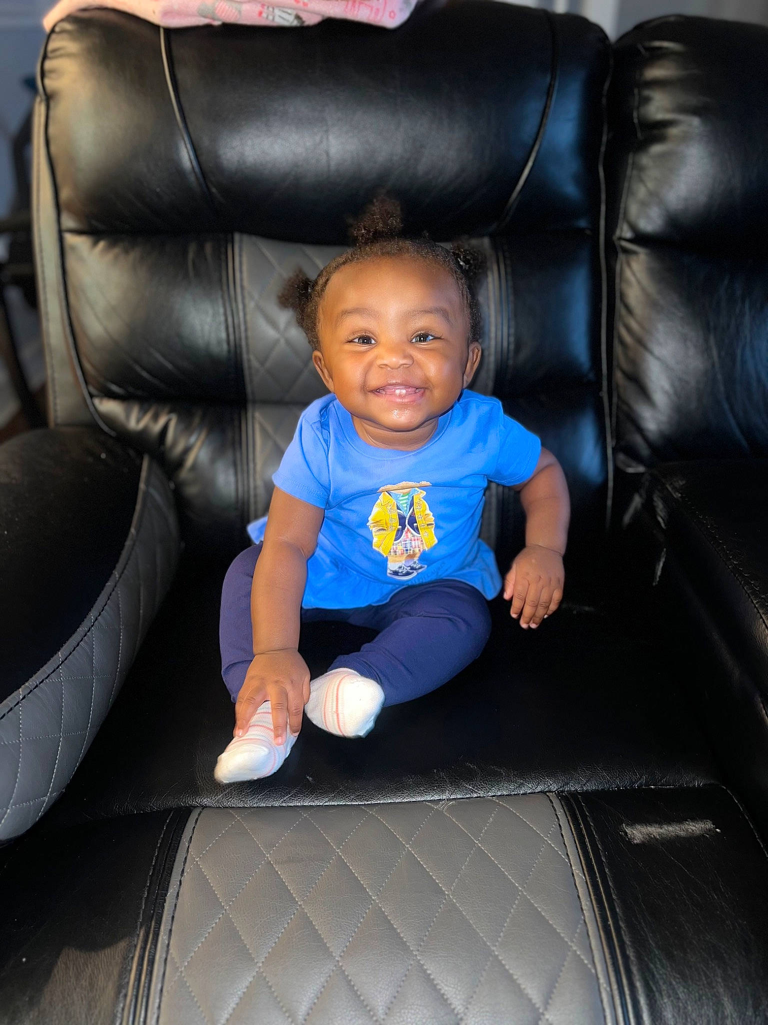 Brooke is registered to the contest to win money with this photo: armrest, auto_part, automotive_design, automotive_tire, baby_toddler_clothing, car_seat, chair, club_chair, comfort, electric_blue, flooring, fun, furniture, joy, luxury_vehicle, person, product, purple, sitting, smile