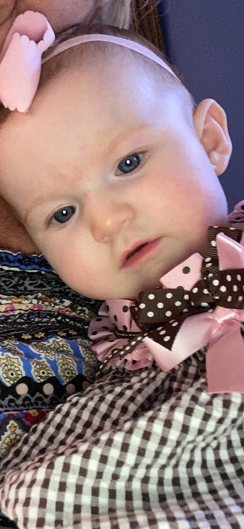 Caroline is registered to the contest to win money with this photo: baby, baby_toddler_clothing, beauty, cheek, child, collar, dress_shirt, eyelash, happy, iris, lip, mouth, nose, pattern, person, pink, plaid, skin, sleeve, textile