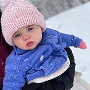 Brynleigh is registered to the contest to win money with this photo: baby, child, winter, snow, hat, knit_hat, pom_pom, jacket, purple_jacket, gloves, black_gloves, outdoor, cold_weather, snowflakes, person, holding, closeup, face, cute, frosty