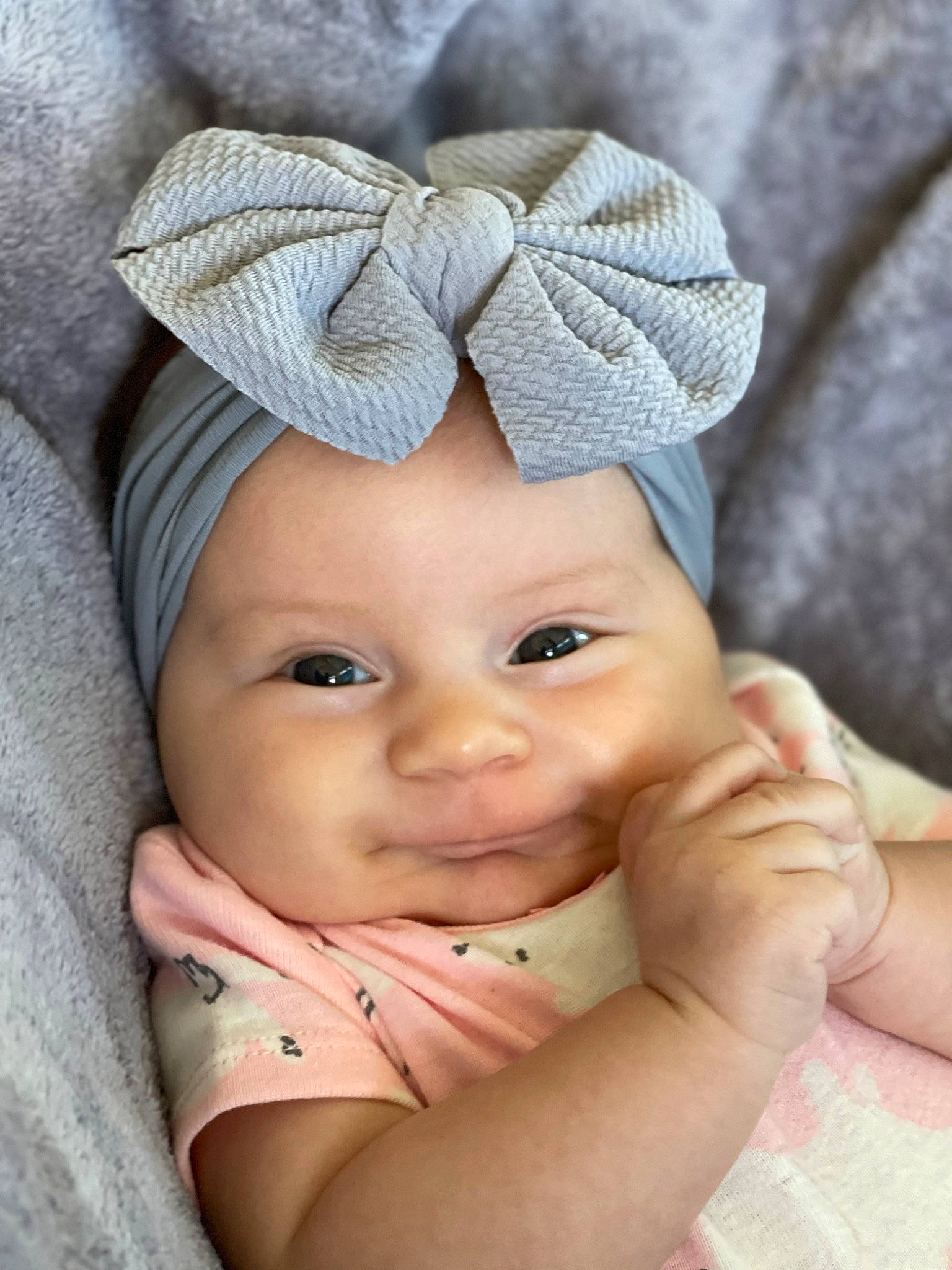Haizley is registered to the contest to win money with this photo: baby, baby_toddler_clothing, beanie, cap, cheek, child, chin, close_up, comfort, fashion_accessory, happy, headgear, headwear, knit_cap, linens, lip, person, skin, textile, thumb