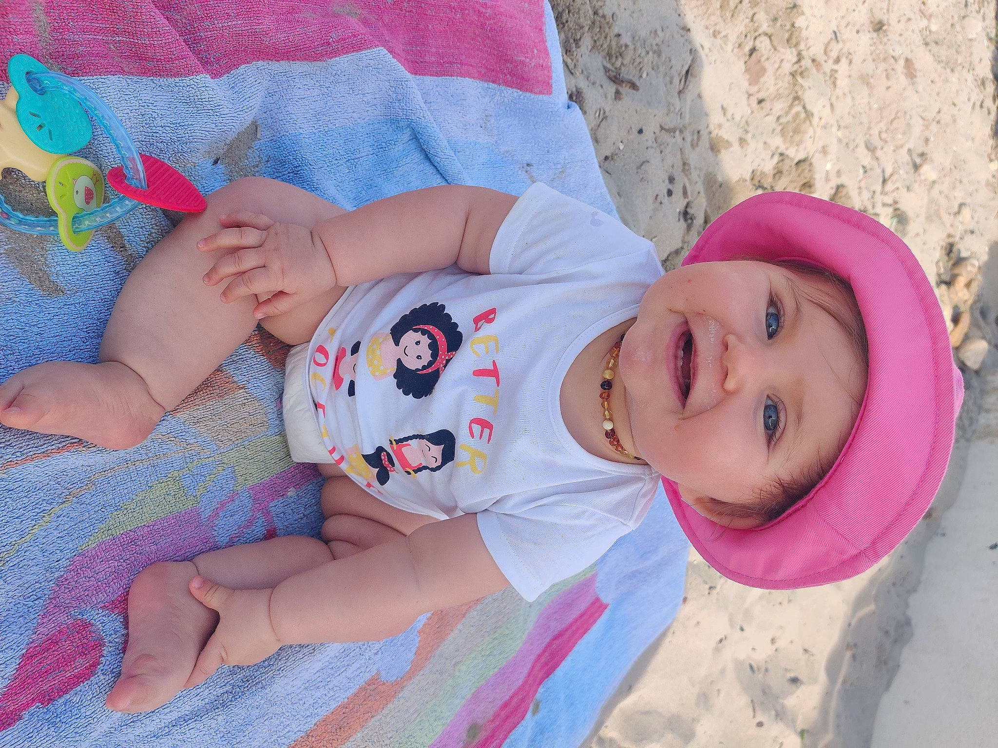 Alessia a rejoint le concours — aidez-le/la à gagner de superbes lots ! arm, baby, baby_toddler_clothing, child, clothing, eye, face, facial_expression, finger, fun, happy, hat, headwear, human_body, joy, leg, person, pink, product, skin