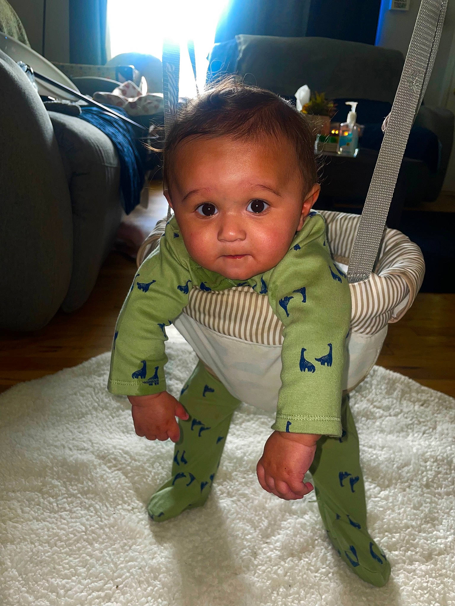 Corey is registered to the contest to win money with this photo: baby, baby_products, baby_toddler_clothing, car_seat, chair, cheek, child, comfort, flooring, foot, fun, happy, person, room, sitting, skin, sleeve, television, thumb, toddler