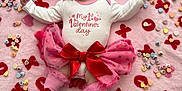 Scarlette is registered to the contest to win money with this photo: baby, infant, onesie, bow, headband, pink, red, blanket, valentines_day, heart, candy, tutu, leg_warmers, smiling, cute, celebration, love, xoxo, sitting, holiday
