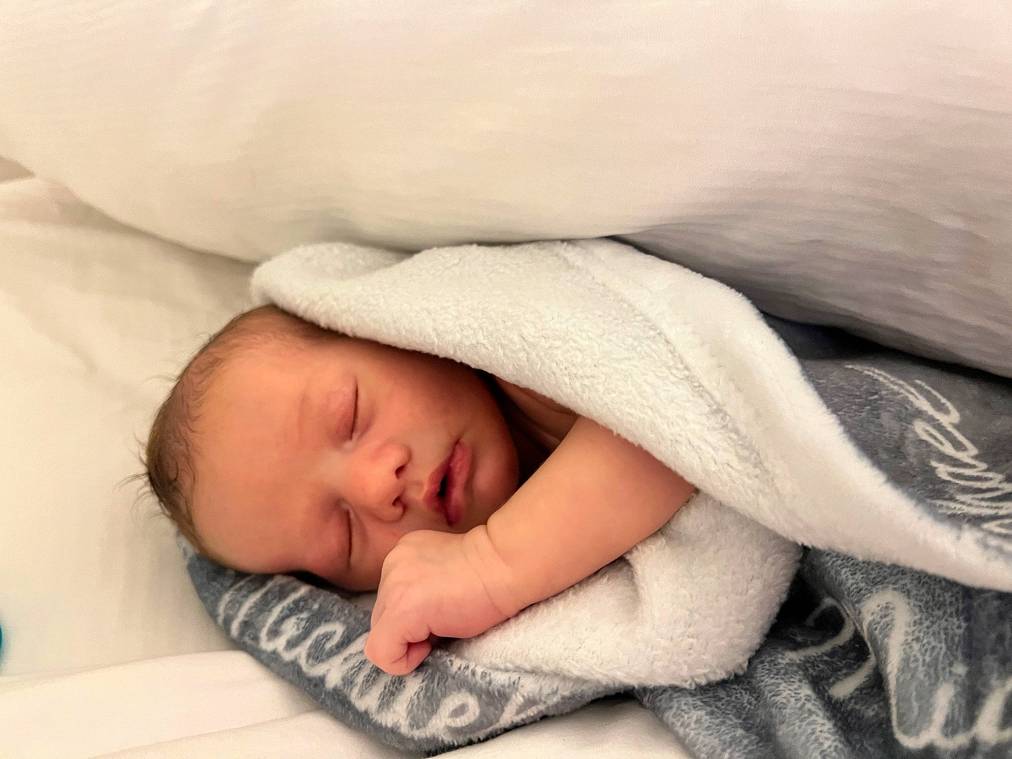 Grant is registered to the contest to win money with this photo: baby, baby_products, baby_sleeping, bed, bedding, bedtime, cheek, child, comfort, face, flesh, gesture, head, linens, nap, nose, person, portrait_photography, room, sleep