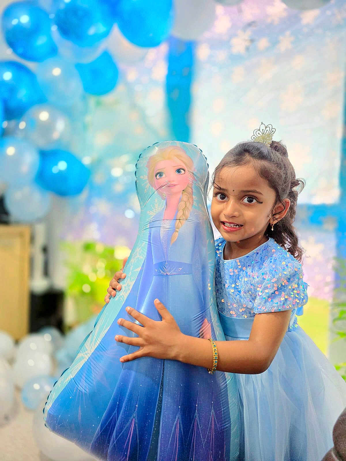 Zara joined the competition — help win amazing prizes! child, girl, balloon, frozen, elsa, blue_dress, party, celebration, smile, happy, indoor, decoration, balloons, sparkle, bracelet, tiara, cute, portrait, festive, young